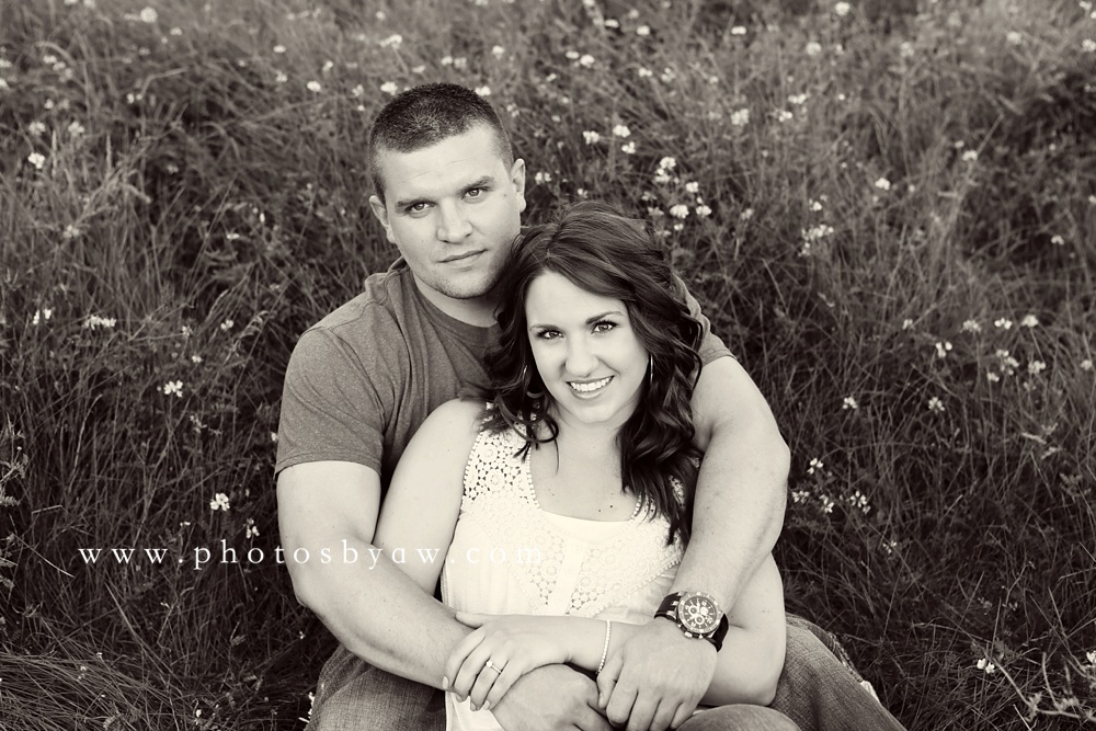 couple sitting in a field