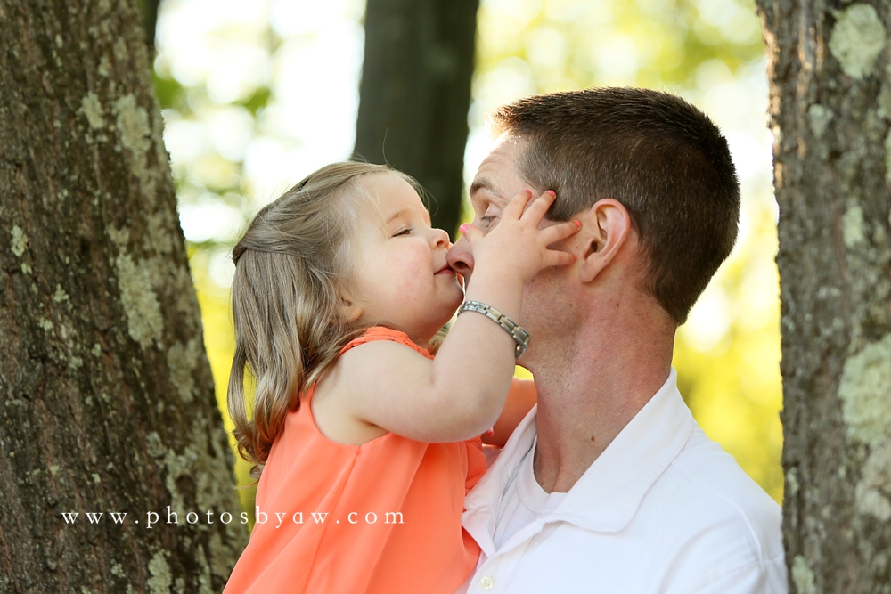 daughter kissing daddy