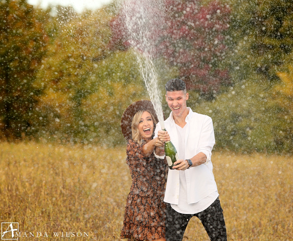 fall_engagement_photos_at_pinehall_champagne_pop